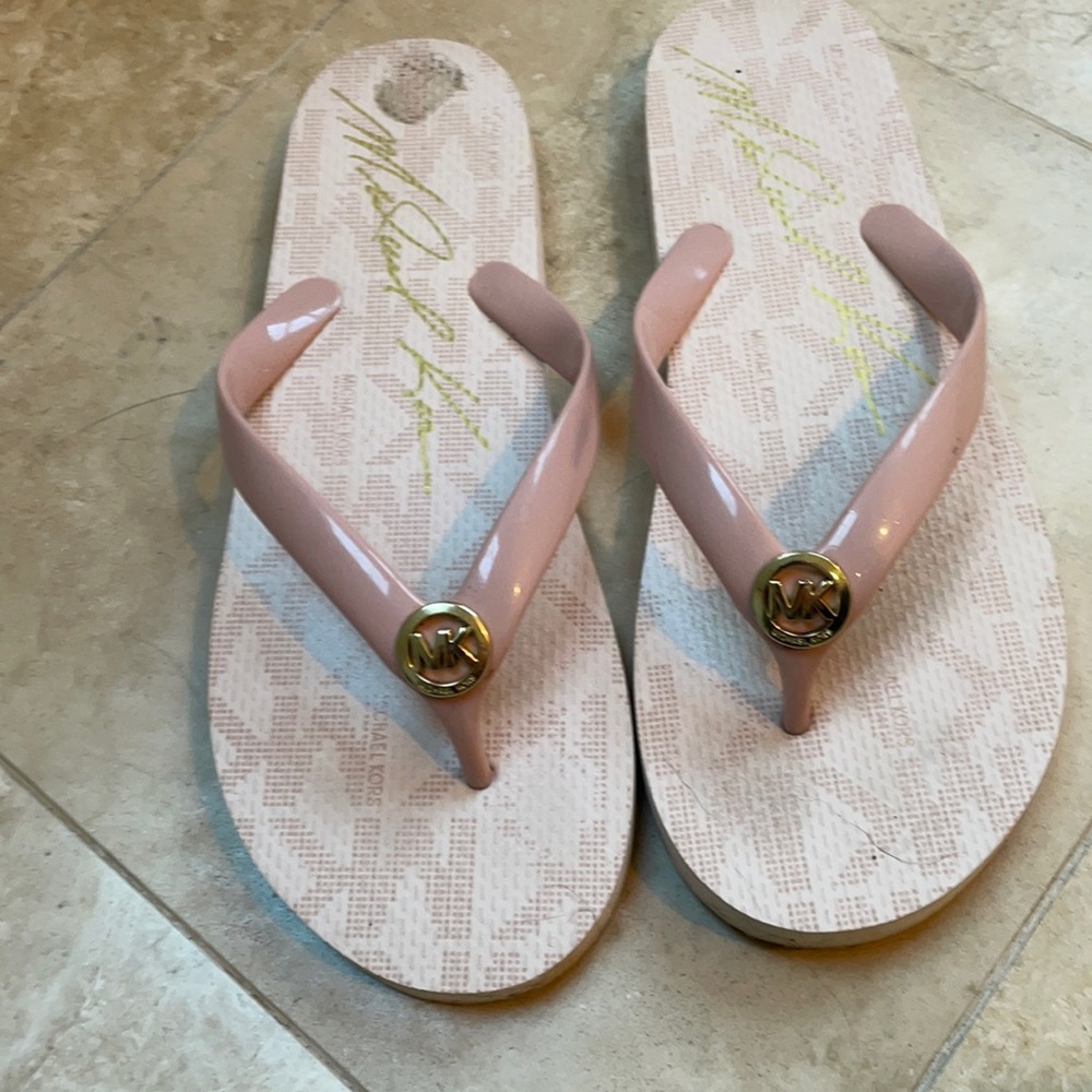 One pair size 8M Michael Kors Flip Flops
